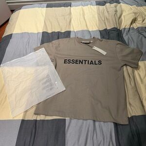 dark green essentials tee shirt.